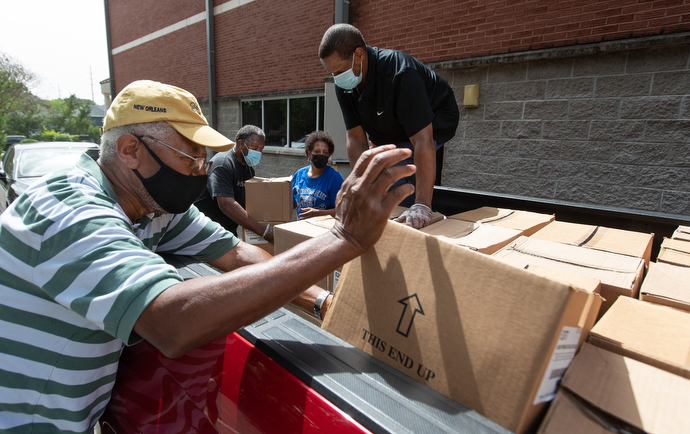 Volunteers unload boxes of produce donated through the Society of St. Andrew at Gordon Memorial United Methodist Church in Nashville, Tenn. The food will be used in the church’s food security ministries with seniors and persons experiencing homelessness. From left are: Cliff Steger, Julius Mitchell, Sandra Ragin-Haddock and Richard Wilson. Photo by Mike DuBose, UM News.