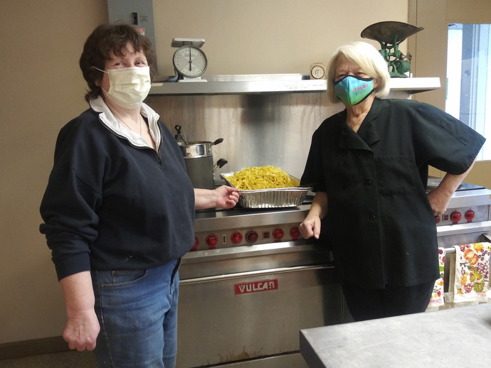 Diana Palmer (left) is the chef and Deb Cappazolli the baker for the community meal service started at First United Methodist Church in Framingham, Mass., to assist during the COVID-19 pandemic. Palmer, a long-time chef and chef manager, created the project, which received a Sheltering in Love grant from the United Methodist Committee on Relief. Photo courtesy of Diana Palmer.