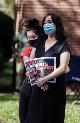 A woman holds a sign that reads “United Methodists stand against racism” during a June 7 Black Lives Matter rally at St. Paul United Methodist Church in Willingboro, New Jersey. Photo by Aaron Wilson Watson.