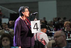 Cynthia Kent, chairperson of the Native American International Caucus, speaks on a petition that asks The United Methodist Church “to be intentional about raising awareness of the harm caused by some sports teams through the use of mascots and/or symbols promoting expressions of racism and disrespect of Native American people," during the May 19 plenary session of the 2016 General Conference in Portland, Ore. File photo by Maile Bradfield, UM News.