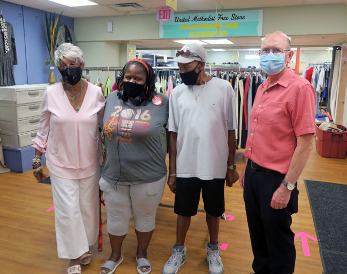 The Rev. John Edgar, executive director of Community Development for All People, in Columbus, Ohio, with three volunteers at the Free Store at the community center. Photo courtesy of Community Development for All People.