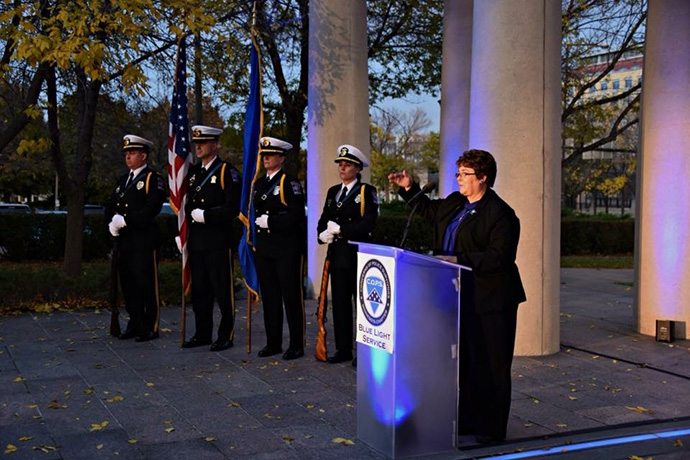 The Rev. Dawn Houser speaks during the Blue Light Vigil in support of families of law enforcement officers killed in the line of duty in St. Paul, Minn. Houser is a police chaplain as well as pastor of Aitkin United Methodist Church in Aitkin, Minn. Photo courtesy of the Rev. Dawn Houser.