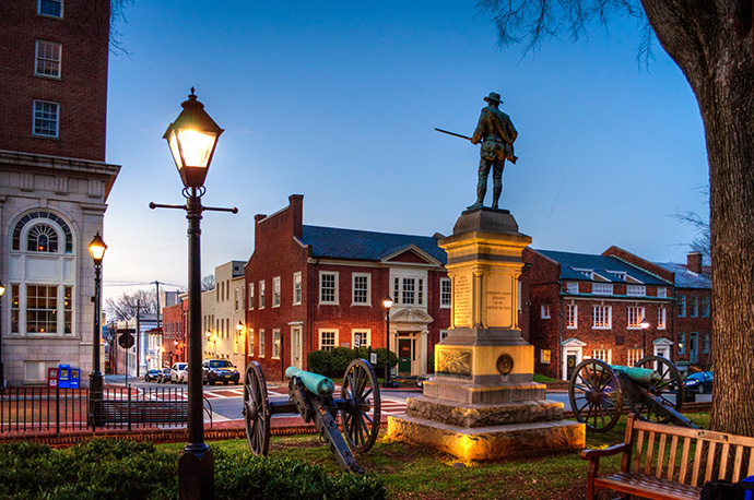 A statue of a Confederate soldier stands in Court Square, downtown Charlottesville, Va., — erected in 1909 and paid for by the county, the city and the United Daughters of the Confederacy. Photo by Bob Mical, Wikimedia Commons.