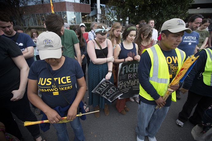 Members and supporters of the Coalition of Immokalee (Fla.) Workers pray in Nashville, Tenn., at the conclusion of a protest against the Publix supermarket chain's refusal to join a farm workers' rights labor program. The Book of Resolutions of the United Methodist Church demands that employers "treat farm workers and their families with dignity and respect.” Photo by Mike DuBose, UM News. Members and supporters of the Coalition of Immokalee (Fla.) Workers pray in Nashville, Tenn., at the conclusion of a protest against the Publix supermarket chain's refusal to join a farm workers' rights labor program. The Book of Resolutions of the United Methodist Church demands that employers "treat farm workers and their families with dignity and respect.” Photo by Mike DuBose, UM News.