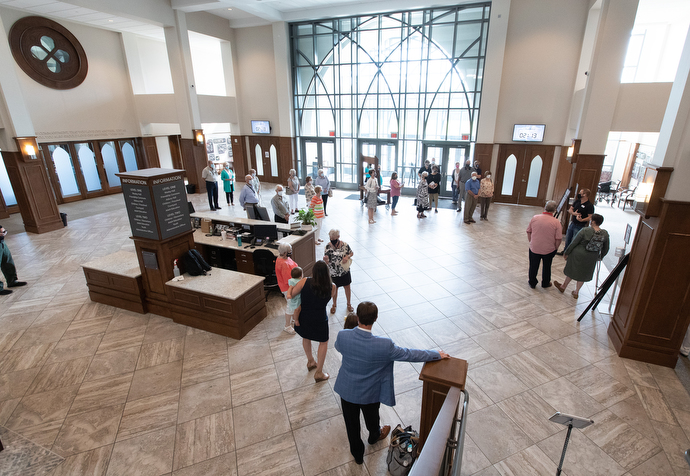 Parishioners gather in the Friendship Commons area to receive safety instructions before worship at Franklin First United Methodist Church. Photo by Mike DuBose, UM News.