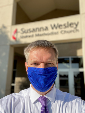 The Rev. Andrew Conard, pastor of Susanna Wesley United Methodist Church in Topeka, Kan., dons a mask for the protection of himself and congregants during worship services. The church resumed worshipping in-person on July 19. Photo courtesy of the Rev. Andrew Conard.