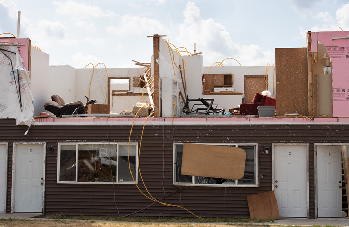 An apartment building stands with its roof open to the sky and top floor walls ripped away following an Aug. 10 derecho in Cedar Rapids, Iowa. Photo by Mike DuBose, UM News.