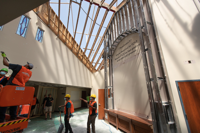A cleanup crew works in the narthex of Christ Community Church in Marion, Iowa. The United Methodist church had part of its roof torn away in an Aug. 10 derecho. Photo by Mike DuBose, UM News.