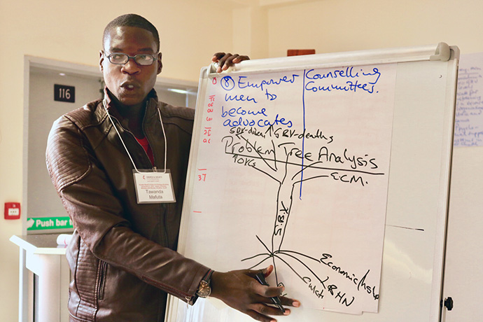 Tawanda Mafuta, a youth member from the Chitungwiza Marondera District, makes a presentation during a gender-based violence awareness workshop hosted by the United Methodist Board of Church and Society for the Zimbabwe Episcopal Area. File photo courtesy of the United Methodist Board of Church and Society. 