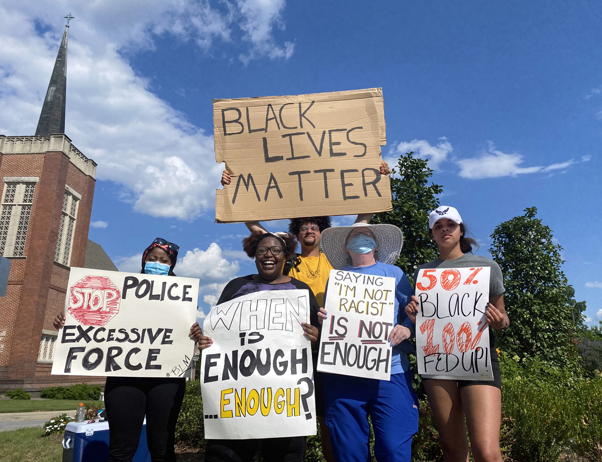 Derian Wilson, a member of Martha Bowman United Methodist Church in Macon, Ga., protests against racism regularly in that city. Wilson (at top in yellow shirt) and fellow activists during one of the three or four protests he leads each week. Photo courtesy of Derian Wilson.