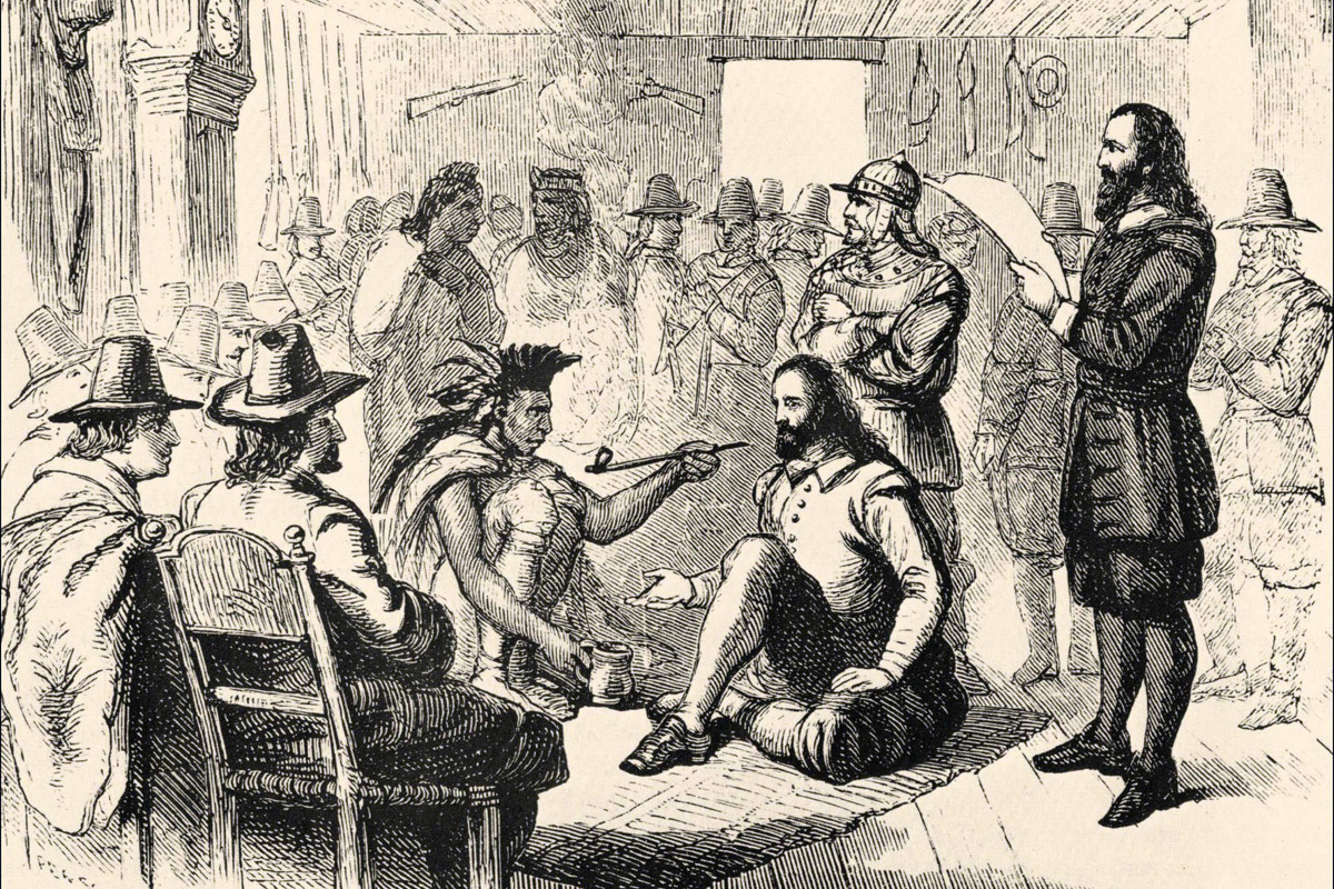 Wampanoag leader Ousamequin (left) and Plymouth Colony Gov. John Carver are depicted smoking a peace pipe as they worked out a treaty of peace and mutual protection on March 22, 1621. The U.S. Thanksgiving Day tradition has mythologized the relationship between the Wampanoag and the English settlers, but the harsher realities provide vital lessons for United Methodists today. Image from the California State Library’s Sutro Library, courtesy of Wikimedia Commons.