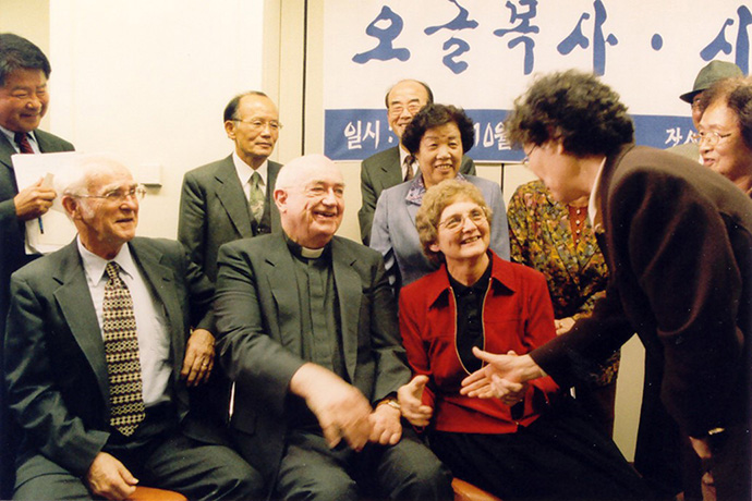 The Korea Democracy Foundation invited the Rev. George Ogle (left), Fr. James Cinot (middle) and Dorothy Ogle (right) to honor their contributions to Korean democracy. They met the victims of the People’s Party in Seoul, Korea, in 2002. File photo courtesy of the Korea Democracy Foundation. 
