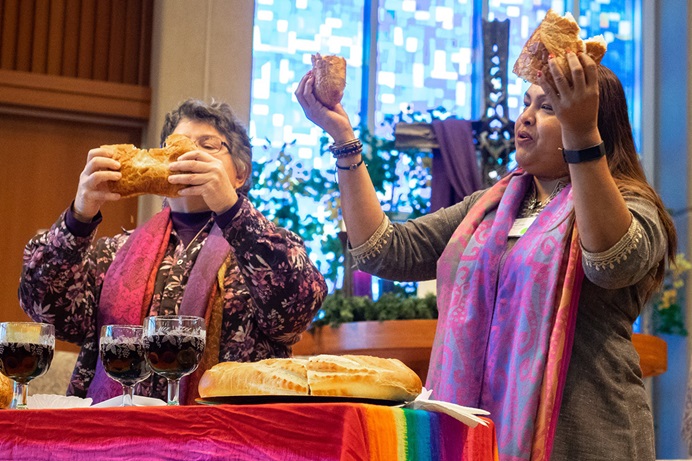The Revs. Martha E. Vink (left) and Alka Lyall lead a Holy Communion service during an Advent gathering in December 2019 at St. Andrew United Methodist Church in Highlands Ranch, Colo. The two are among the collaborators organizing the Liberation Methodist Connexion, a new denomination that held an online launch event on Nov. 29. Photo courtesy of LMX.