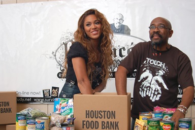 The Rev. Rudy Rasmus, senior pastor at St. John’s Downtown Church in Houston and editor of the book “I’m Black. I’m Christian. I’m Methodist,” attends a food bank event with the singer Beyoncé, who grew up in that church. Photo courtesy of St. John’s Downtown Church in Houston. The Rev. Rudy Rasmus, senior pastor at St. John’s Downtown Church in Houston and editor of the book “I’m Black. I’m Christian. I’m Methodist,” attends a food bank event with the singer Beyoncé, who grew up in that church. Photo courtesy of St. John’s Downtown Church in Houston.