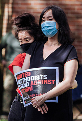 A woman holds a sign saying, “United Methodists stand against racism,” during a Black Lives Matter rally in Willingboro, N.J., on Sunday, June 7, at St. Paul United Methodist Church. File photo by Aaron Wilson Watson.