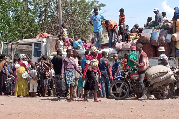 Displaced people, including United Methodists, from Mutwangwa and Eringeti villages arrive in Beni, Congo, after fleeing an attack by insurgents. Twenty-five civilians, including seven United Methodists, were killed in the Dec. 31 massacre. Photo by Philippe Kituka Lolonga, UM News.