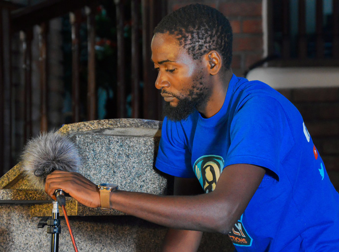 Rutendo Luckmore Kufarimayi of Cranborne United Methodist Church in Harare, Zimbabwe, sets up a professional microphone covered with a windscreen to capture sound for the video camera. Photo courtesy of Rutley Productions, a YouTube Channel offering United Methodist-related videos.