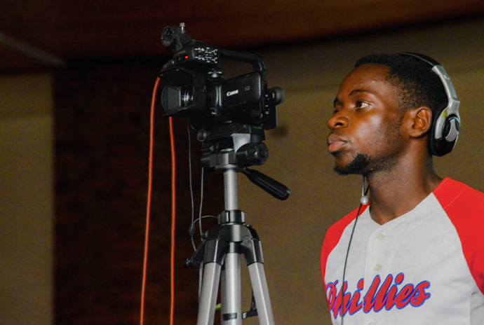 Videographer Walter Tumba monitors the camera to keep the subject centered in the viewfinder while taping at Cranborne United Methodist Church in Harare, Zimbabwe. Photo courtesy of Rutley Productions, a YouTube Channel offering United Methodist-related videos.