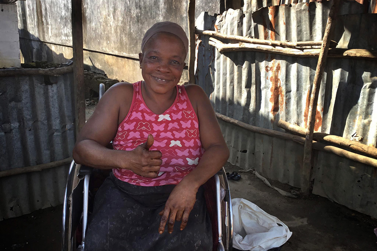 Alice M. Nyankolor expresses her appreciation for the new wheelchair she received thanks to Asbury United Methodist Church in Allentown, Pa., in cooperation with Healthy Women, Healthy Liberia’s Waterfield Primary Healthcare Center in Kakata, Liberia. Photo by E Julu Swen, UM News.