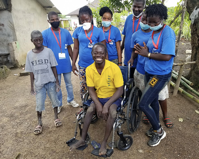 Victor Barlay is all smiles after receiving a new wheelchair from Asbury United Methodist Church in Allentown, Pa., through its Barrels of Love ministry and a partnership with Healthy Women, Healthy Liberia. The 45-year-old basket maker used to get around by wearing flip-flops on his hands. Photo courtesy of Healthy Women, Healthy Liberia.