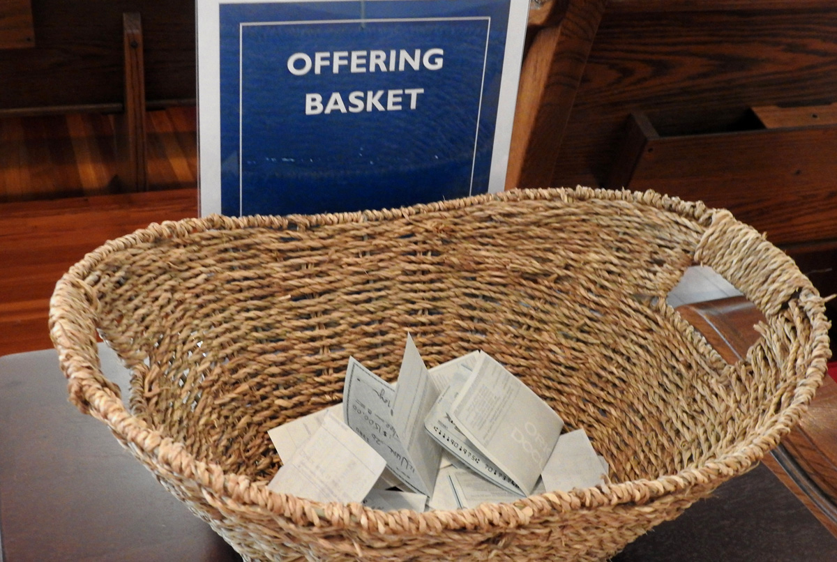 View of the offering basket at First United Methodist Church of Sulphur Springs, Texas, in 2020. Overall collection rates for general church ministries were higher than feared, but COVID-19 still presents a great deal of uncertainty for church financial leaders. File photo by Sam Hodges, UM News.