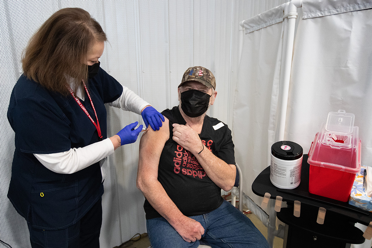Stephen Saucerman receives a COVID-19 vaccination from volunteer nurse Jackie Smith, RN, at Community United Methodist Church in Vincennes, Ind. Photo by Mike DuBose, UM News.