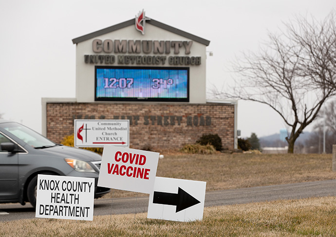 A car pulls into the driveway at Community United Methodist Church in Vincennes, Ind., which is hosting a COVID-19 vaccination site in its recreational center. Health workers there have been vaccinating about 100 people a day. Photo by Mike DuBose, UM News.