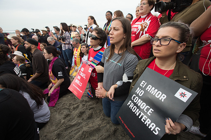 United Methodists and other faith leaders protest at the U.S.-Mexico border near San Diego in 2018 in support of migrants seeking refuge in the U.S. From right are: Emma Escobar of the Baltimore-Washington Conference, Rebecca Cole of the United Methodist Board of Church and Society and the Rev. Julie Wilson of Calvary United Methodist Church in Frederick, Md. Church and Society continues to advocate for climate, health, immigration, peace and poverty with a focus on dismantling racism and colonialism, said the Rev. Susan Henry-Crowe, the agency’s top executive. File photo by Mike DuBose, UM News.