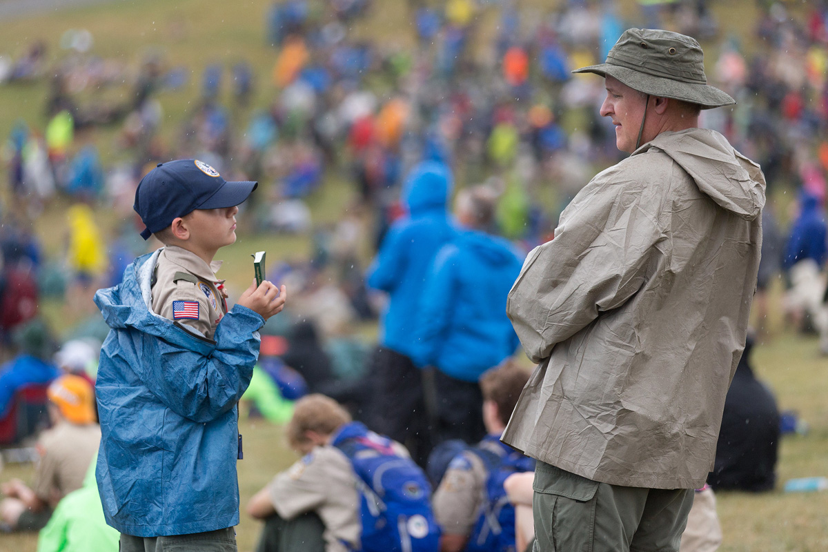 A Scout shows his copy of the United Methodist devotional guide "Strength for Service" to an adult leader at the 2017 National Scout Jamboree at the Summit Bechtel Reserve in Glen Jean, W.Va. The General Commission on United Methodist Men supports Scouting and publishes the “Strength for Service” devotional series. File photo by Mike DuBose, UM News.