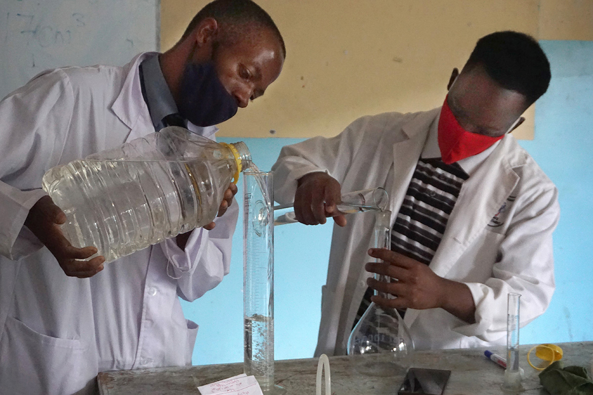 Innocent Mushayavanhu (left) and Tariraishe Mubazangi prepare hand sanitizer at The United Methodist Church’s Murewa High School in Murewa, Zimbabwe. “We managed to prepare ministerial-approved sanitizers and face masks for the school of 1,250 learners, 30 workers and 55 teachers,” said Sydney Mapisaunga, the school’s headmaster. Photo by Kudzai Chingwe, UM News.