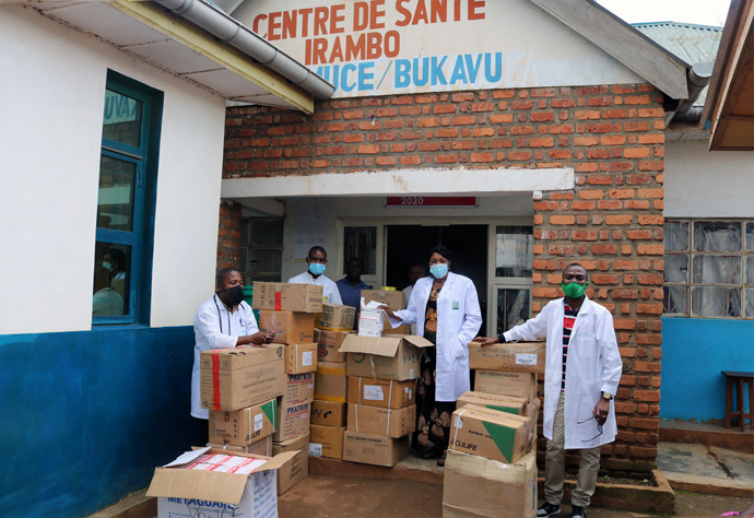 Dr. Marie Claire Unda (center, under door) oversees the distribution of medication to support people living with HIV at United Methodist Irambo Hospital in Bukavu, Congo. Unda, who coordinates the Maternal and Child Health Program in East Congo, said that the COVID-19 pandemic could significantly affect the number of people living with HIV. Photo By Philippe Kituka Lolonga, UM News.
