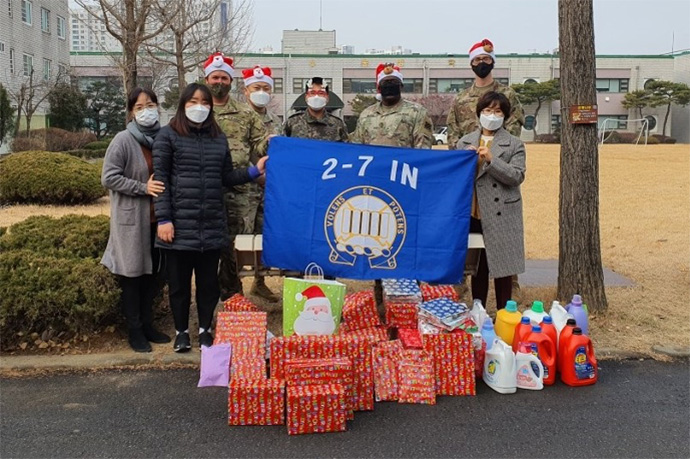 Soldiers at U.S Army Garrison Humphreys in Pyeongtaek, South Korea, pose with Christmas gifts they collected for Jacob’s House, a local orphanage. Photo courtesy of the Rev. DooSoo Lee, U.S. Army.
