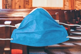 Churches are adopting safety protocols as they open for modified services during Holy Week. Pews by Andrew Seaman, courtesy of Unsplash; mask image courtesy of Pixabay.