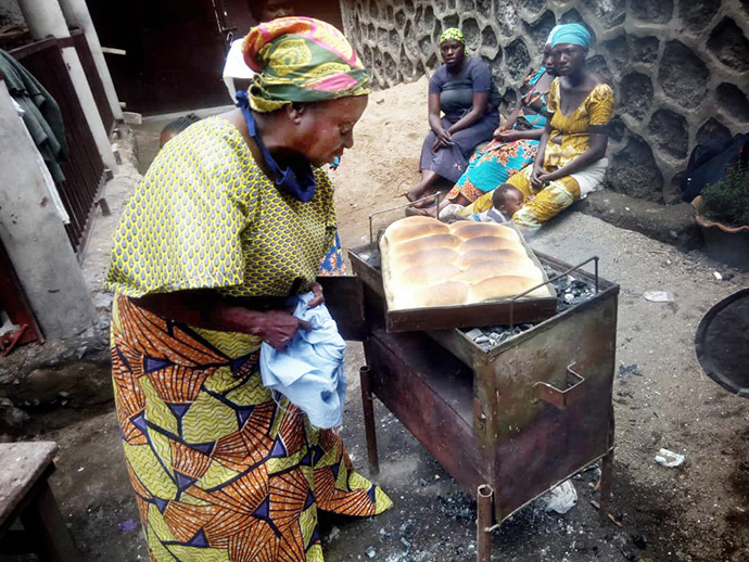 Omoyi Wandjaka teaches United Methodist women in Kivu, Congo, how to make bread to generate income for their families. Photo by Philippe Kituka Lolonga, UM News.