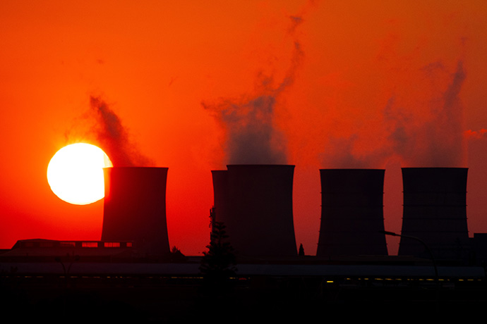 Water vapor rises from cooling towers at the coal-fired Kelvin Power Station in Johannesburg, South Africa in 2019. The “Natural World” section of the denomination’s Book of Discipline says United Methodists “acknowledge the global impact of humanity’s disregard for God’s creation.” File photo by Mike DuBose, UM News.