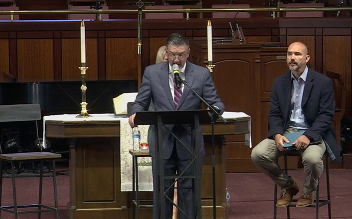 During an April 26 press conference given by Mt. Bethel United Methodist Church, Jody Ray surrenders his clergy credentials in response to being reassigned by Bishop Sue Haupert-Johnson. Church leaders also announced the congregation is beginning the process of disaffiliating from The United Methodist Church. Screenshot of livestream courtesy of Mt. Bethel United Methodist Church. 