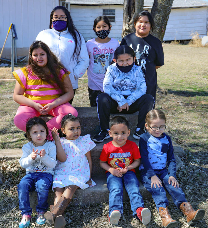Children at Petarsy United Methodist Church near Lawton, Okla., received gifts of clothing and masks through a donation by the National Network of Korean United Methodist Women to the Oklahoma Indian Missionary Conference. The OIMC includes 81 Indian United Methodist churches representing more than 45 tribes in Oklahoma, Kansas and Texas. Photo by Ginny Underwood. 