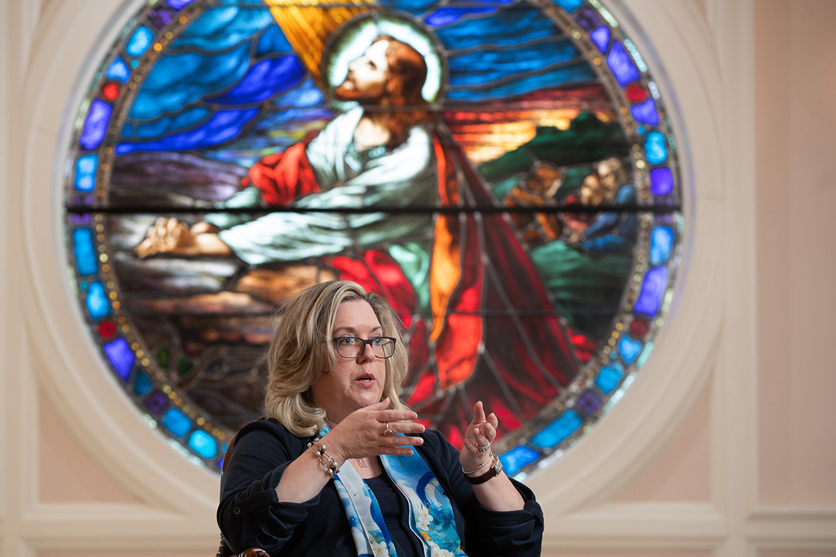 Kellie D. Brown is the author of “The Sound of Hope: Music as Solace, Resistance and Salvation During the Holocaust and World War II.” She discusses the book while seated in front of a stained-glass depiction of Jesus at First Broad Street United Methodist Church in Kingsport, Tenn., where she is a member. Photo by Mike DuBose, UM News.