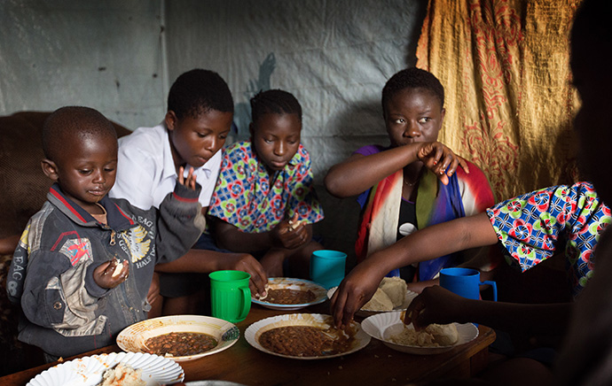 Children share a meal at the United Methodist orphanage in Goma, Congo, in 2015. Current residents of the orphanage were evacuated following the May 22, 2021, eruption of the Mount Nyiragongo volcano. File photo by Mike DuBose, UM News.