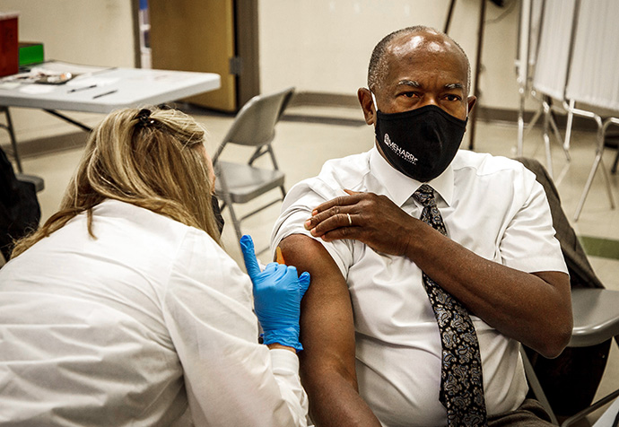Dr. James Hildreth, president of Meharry Medical College in Nashville, Tenn., receives a COVID-19 vaccination at a city-run clinic in December 2020.  Hildreth said in news reports at the time that he received the vaccine on camera in order to demonstrate his confidence in its safety. Photo courtesy of Meharry Medical College.