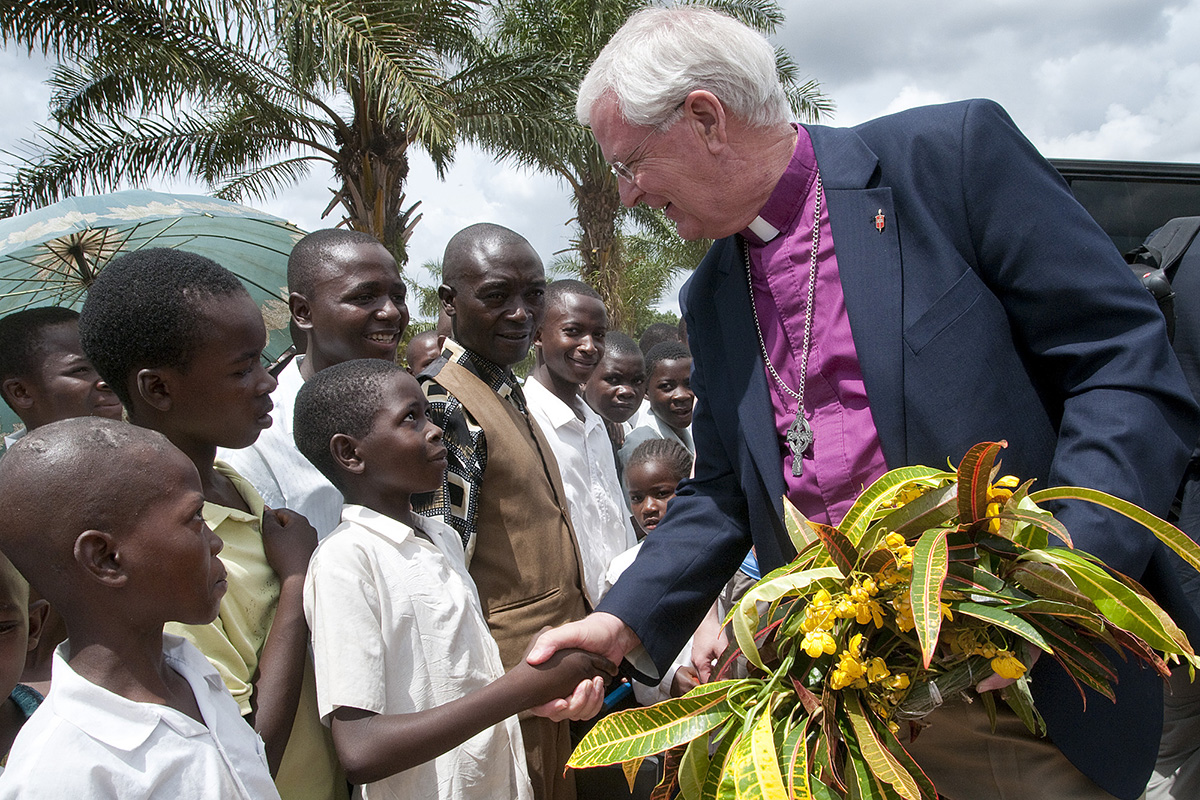 Former United Methodist Bishop James E. Dorff is welcomed in Kamina, Congo, as part of a delegation that traveled from the U.S. in observance of World Malaria Day in 2010. Dorff died June 7. He was 73. File photo by Lynne Dobson.