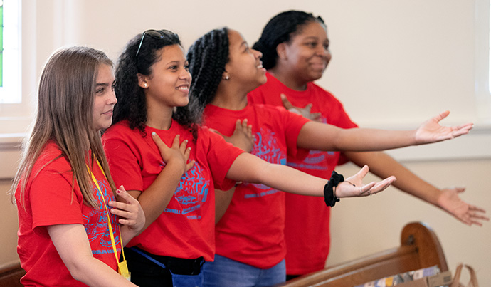 Counselors sing during vacation Bible school at Connell Memorial United Methodist Church. From left are: Emme Sinclair Krueger, Sanáa Carroll, Jayla Frazier and Jayde Frazier. Photo by Mike DuBose, UM News.