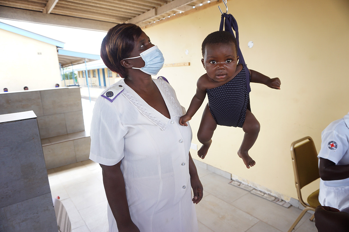 Emilia Benhilda Marembo weighs a baby at the Dindi United Methodist Clinic in Murewa, Zimbabwe. The rural clinic is an outreach of Nyadire United Methodist Hospital  Photo by Kudzai Chingwe, UM News. 