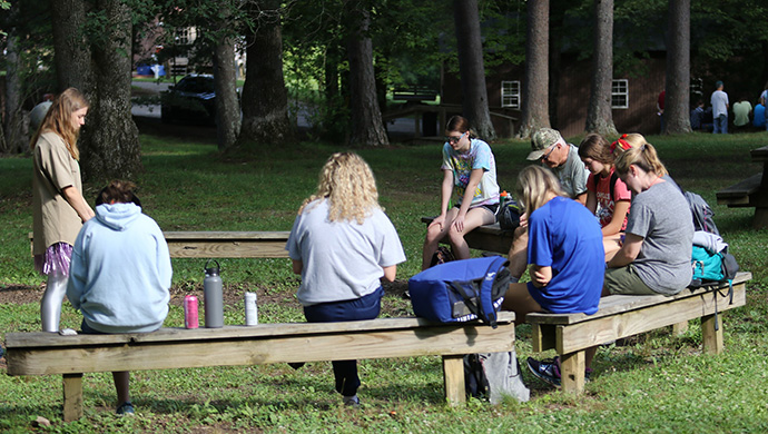 Mission team members hold a morning devotional at the Mountain T.O.P. ministry headquarters in Coalmont, Tenn., before leaving for their work site. Photo by the Rev. Thomas Kim, UM News.