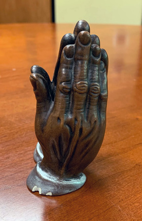 A statue of praying hands was given to Michigan Area Bishop David Alan Bard for a sermon he preached as a Boy Scout. That was his first sermon, and he has kept the statue through the years. Photo courtesy of Bishop David Bard.