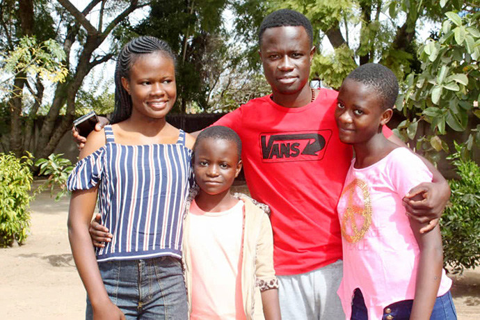 Mellan Nyagato (left) poses with her siblings in Harare, Zimbabwe. The Africa University junior is coping with her father’s death from COVID-19 while studying online with her sisters. Photo courtesy of Mellan Nyagato.