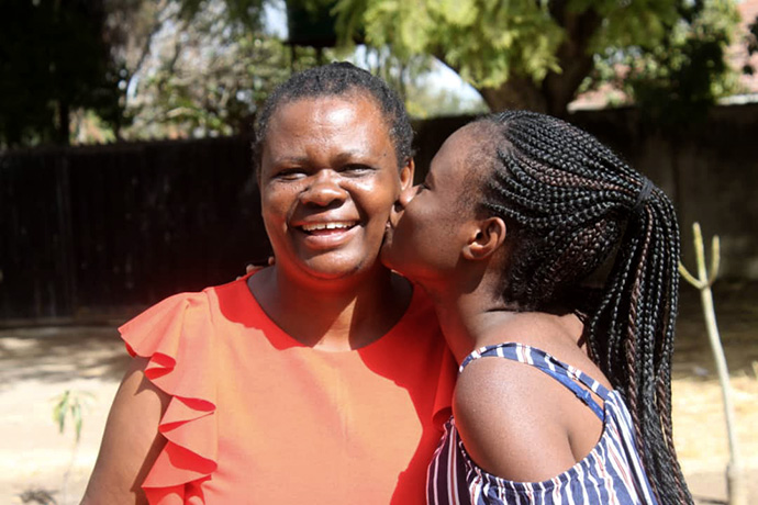 Mellan Nyagato kisses her mother, Jestina, who is recovering from a stroke. Photo courtesy of Mellan Nyagato.