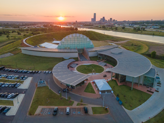 The First Americans Museum during sunset, set against the Oklahoma City skyline.  Photo courtesy of First Americans Museum. Click here to enlarge the image.