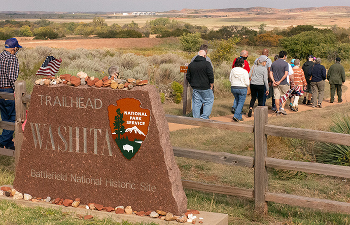 A group of United Methodists and other participants hike to the site along the Washita River where a village of peaceful Cheyenne were attacked by U.S. cavalry in 1868. The site, now designated as a National Park, is outside Cheyenne, Oklahoma. Photo by Tim Tanton, UM News.
