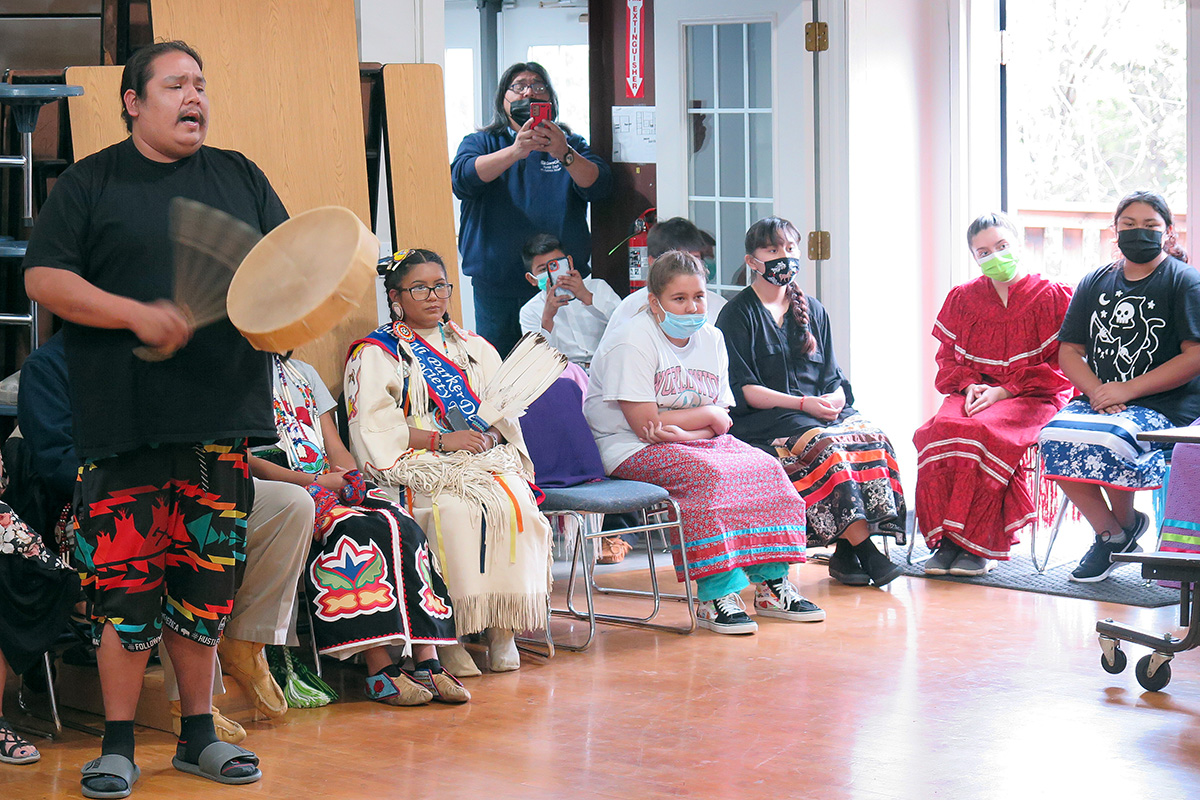 Nic Hamilton, a Cheyenne and Arapaho, performs an original song during a presentation for a group of United Methodist visitors at Sovereign Community School in Oklahoma City. The group of about 40 people were participating in an immersion into Native American culture and ministries sponsored by The United Methodist Church’s Oklahoma Indian Missionary Conference. Photo by Tim Tanton, UM News.